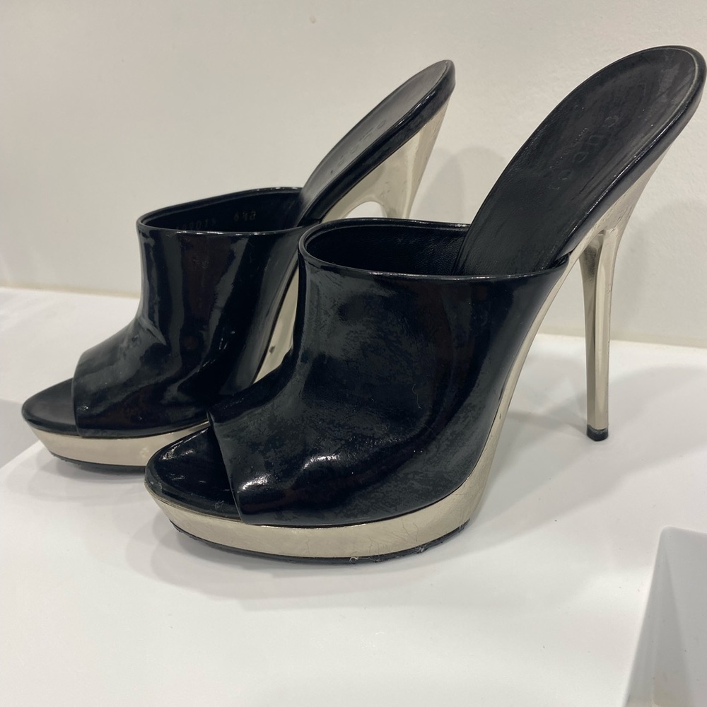 Black patent Gucci stiletto silver heels.